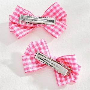 Set of two pink checkered bow hair clips with silver metal duckbill clips on back
