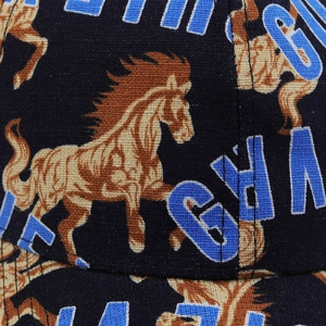 Macro detail of twill fabric baseball cap with horse pattern and blue letter printing