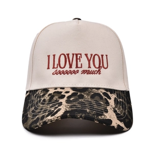 Detail showing embroidered I LOVE YOU text and leopard print brim on baseball cap