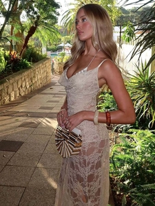 Sexy backless lace camisole dress in beige for women, shown in a tropical resort setting