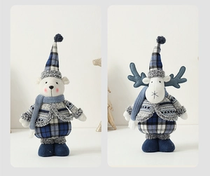 Detail of Mediterranean blue and white plush Christmas bear and reindeer ornaments
