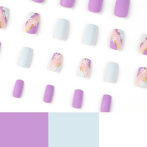 Blue and purple French press-on nails with white flower patterns and gold glitter accents