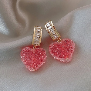 Pink crystalline heart drop earrings with gold metal and sparkling zircon stones