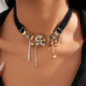 Detail of plush choker with bear pendant, pearl accents and sparkling rhinestone fringe