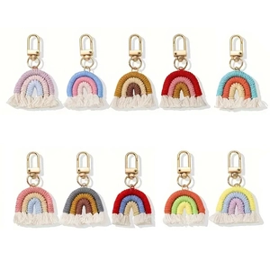 Collection of ten handmade rainbow cotton woven keychains with golden metal hooks and tassels