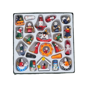 Set of colorful wooden Christmas tree ornaments featuring hand-painted figures and motifs