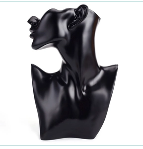 Macro shot of smooth black resin bust stand for elegant necklace and jewelry display