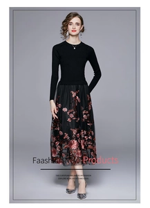 Detailed view of exquisite red and pink sequin floral embroidery on black mesh skirt
