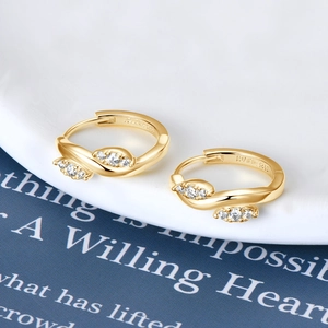 Macro detail of S925 sterling silver hoop earrings with zircon pavé and inner hallmarks