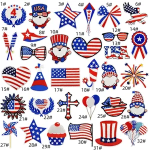 Detailed grid view showing 32 assorted July 4th patriotic embroidered patches in red and blue