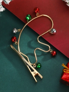Detail view of festive reindeer antler hair clip with colorful jingle bells and gold wire
