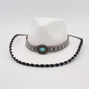 Detail of white felt cowboy hat with turquoise gemstone and black stitched brim edge