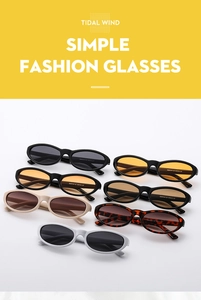 Close-up of vintage oval cat-eye sunglasses showing assorted frame colors and temple specs
