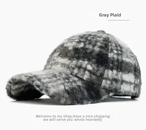 Detailed close-up showing the soft gray check plush texture of the winter baseball cap