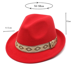 Detail view of red wool fedora hat with dimensions and ethnic patterned trim