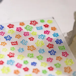 Macro view of colorful small flower nail art stickers with Childhood theme and hollow design