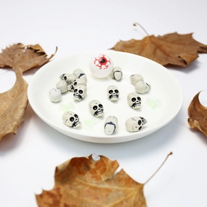 Halloween DIY set with mini skulls, bloodshot eyeball, and spiders for spooky decoration