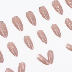 Elegant almond-shaped press-on nails in nude pink with colorful glitter tips and glossy finish