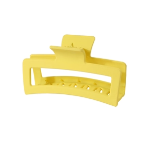 Detail of a large 13cm matte yellow square hair claw clip with hollow geometric design
