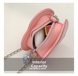 Internal capacity of pink heart-shaped PU leather crossbody bag with chain strap