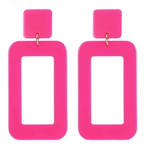 Detailed view of vibrant hot pink geometric acrylic drop earrings on a white background