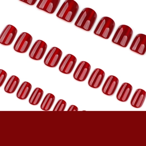 Deep wine red cat-eye press-on nails set with glossy finish on white background