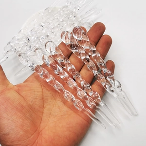 Set of clear acrylic spiral icicle ornaments for Christmas tree decoration held in hand