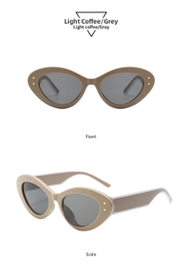 Detail of light coffee cat-eye sunglasses with gray lenses and gold star accents