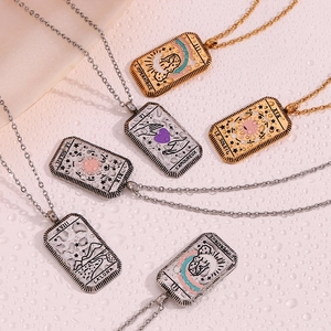 Detail of tarot card pendants with 18K gold and silver plating and French engravings