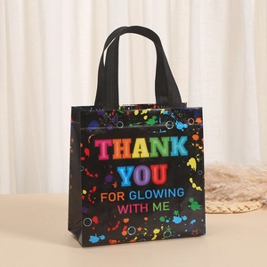 Black non-woven gift bag with colorful Thank You text and artistic paint splash print