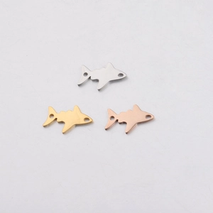 Three shark pendants in silver, gold, and rose gold finishes with double connector holes