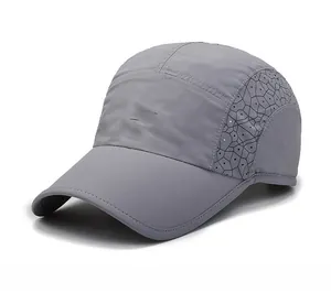 Detail of grey quick-dry sports cap featuring laser-cut ventilation and brand logo