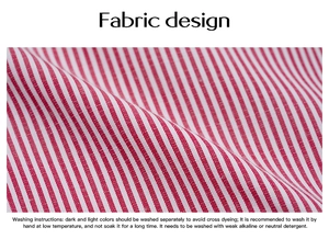 Detail of red and white striped fabric texture and washing care label instructions