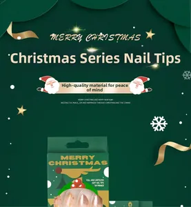 Close-up of nude pink Christmas press-on nails with gold glitter in reindeer packaging