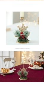 Close-up of golden snowflake candle holder with red berries and pine cone decoration