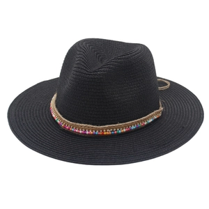 Close-up of black straw sun hat featuring colorful beaded band and hemp rope detailing
