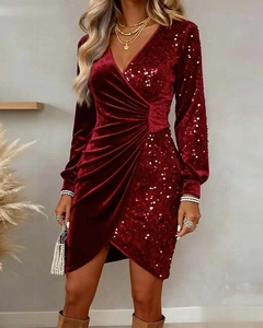 Close-up of burgundy velvet fabric with sequin stitching and waist pleats detail