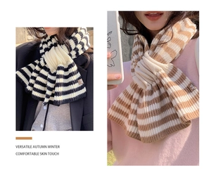 Detail view of striped wool blend scarves in black, white, and brown colors