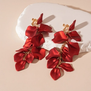 Detail of dark red matte acrylic petal earrings with long metal chain tassels and ear clips