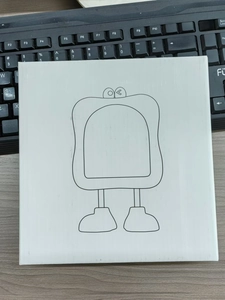 Close-up of a white desktop makeup mirror with a cute minimalist cartoon face pattern