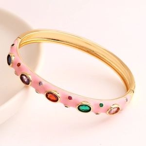 Chic pink enamel open bangle with colorful zircon stones in gold-plated copper finish