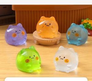 Close-up of five colorful luminous resin cat figurines for micro landscape decoration