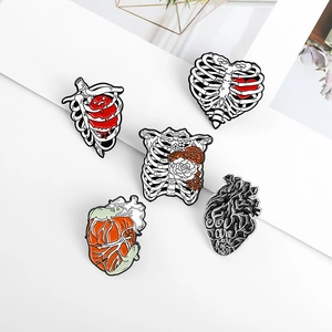 Set of 5 metal anatomical pins featuring heart and ribcage designs for medical gifts