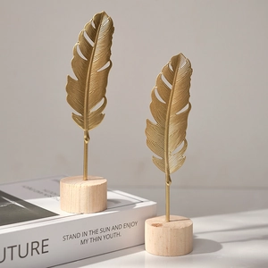 Modern gold metal feather ornaments with wood bases for luxury home decoration