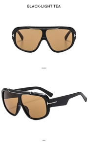 Front and side views of oversized black aviator sunglasses with light tea lenses and T-logo