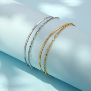 Double-layered snake bone and bead chain bracelets in gold and silver finish for women