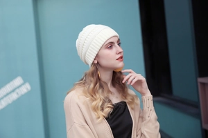 Detail of cream chunky knit beanie for women showing soft texture and cozy fit