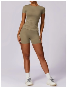 Front view of olive green slim-fit yoga t-shirt and matching high-stretch sports shorts