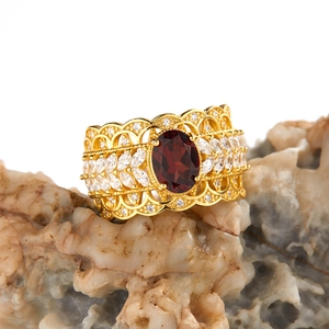 Luxurious S925 silver wide ring with garnet and topaz stones on a textured rock base