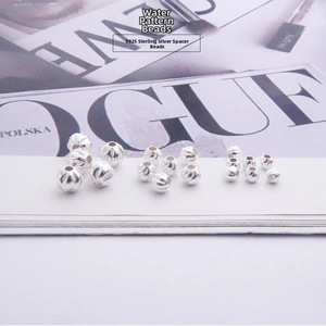 Macro shot of S925 sterling silver water ripple spacer beads for DIY jewelry making